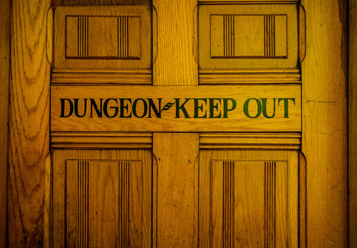 Humorous Keep Out sign on a door in an antique hotel 