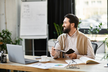 Fototapeta premium Focused and cheerful businessman engaged in creative work at his office desk