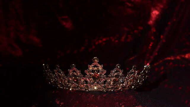 Elegant vintage gold crown with gemstones on velvet background, luxury brand and premium concept.
Refined vintage gold crown decorated with diamonds