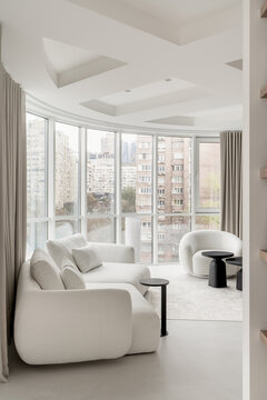 Light apartment in contemporary style with white and black furniture