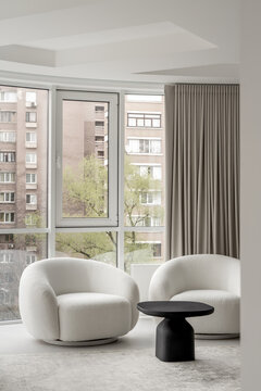 Light apartment in contemporary style with white and black furniture