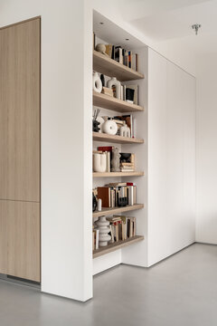 Light apartment in contemporary style with white and wood furniture