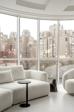 Light apartment in contemporary style with white and black furniture