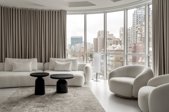 Light apartment in contemporary style with white and black furniture