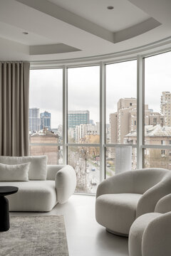 Light apartment in contemporary style with white and black furniture