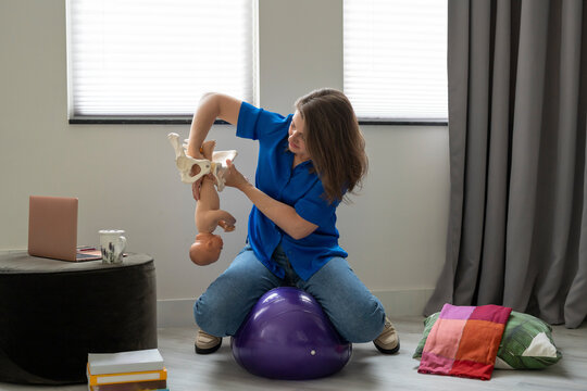 Demonstration of a baby passing through a pelvis
