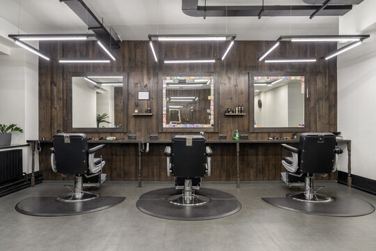 Illuminated classic male hairdresser in loft style