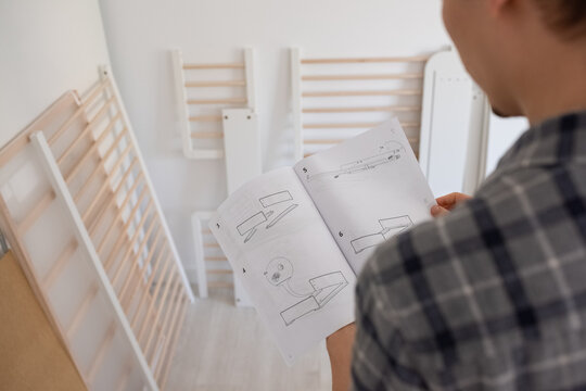 Man looking through instruction