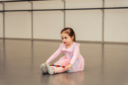 Girl sitting in a dance studio