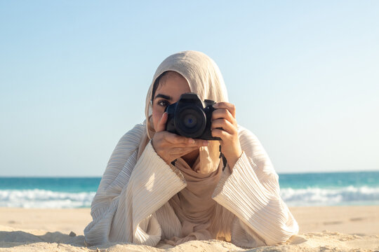 Young Women Takes Selfie on Beach