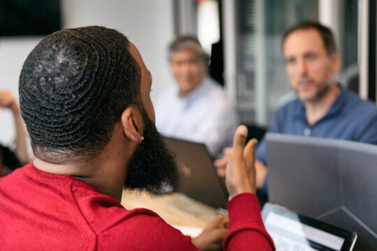 Business: Man Explaining Situation To Team Members