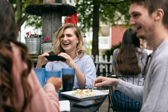 Dining: Woman Taking Photo Of Salad On Cell Phone