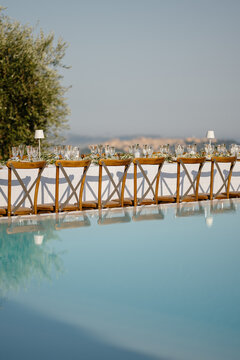 Elegant wedding decor by the pool in Italy