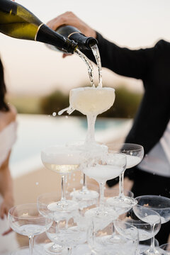 Champagne tower celebration at an outdoor event