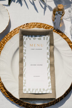 Elegant wedding decor featuring menu at Italian setting
