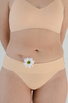 Plus size woman body part with flower