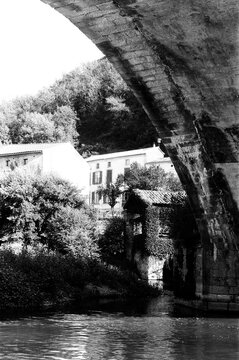 River under a bridge in a French village