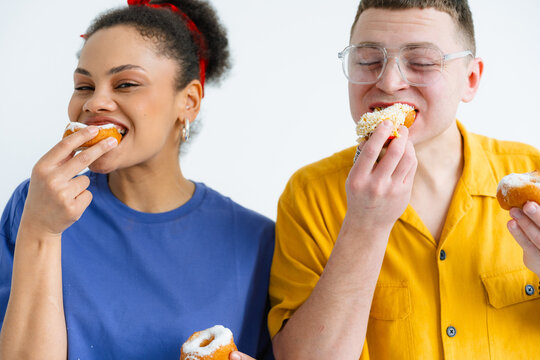 A man and a woman with the donuts