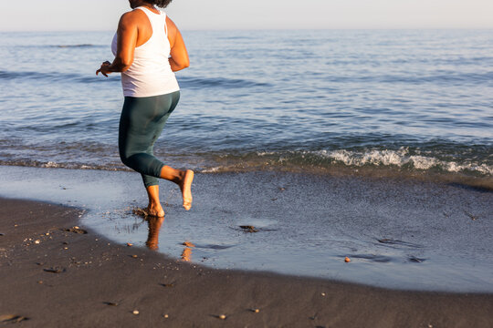 a woman doing sports on the beach