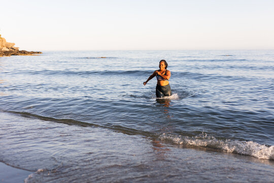 a woman doing sports on the beach