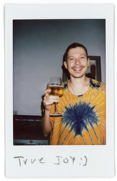 Celebrating Happiness With a Drink in a Colorful Shirt