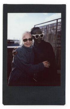 Mother and daughter in law hugging at rooftop