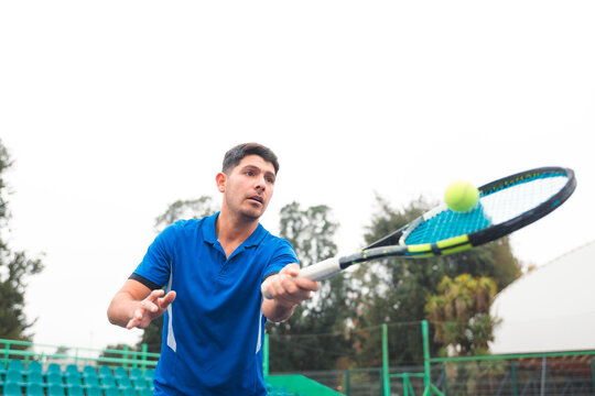 Young Tennis Player Hitting Forehand Return 
