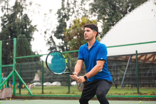 Tennis Player in Ready Position Awaiting Return