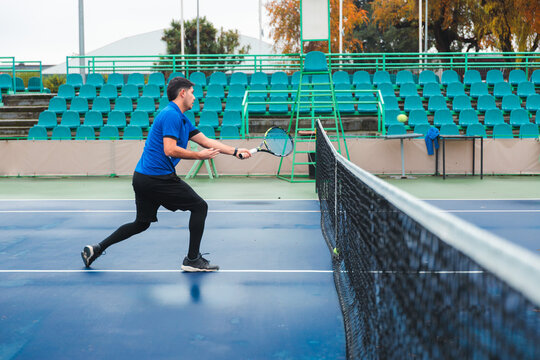 Tennis Player Returning Next to the Net