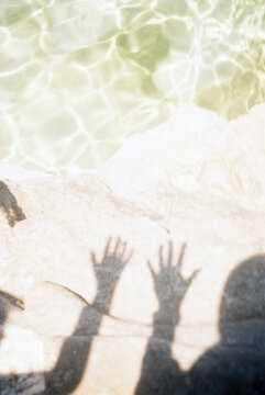 Sunlit Hand Shadows over Water on 35mm Film