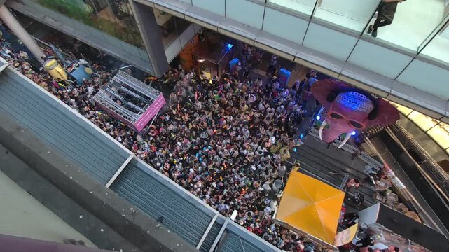 14 Aril 2026, Dynamic aerial footage capturing the vibrant atmosphere of the Songkran Festival along Silom Road in Bangkok, Thailand. Large crowds gather to celebrate with water guns