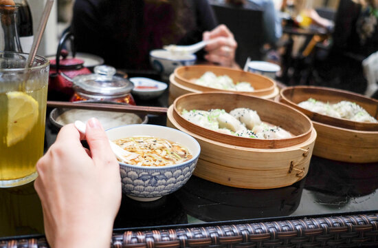 Hand Reaching for Noodles