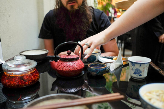 Pouring Tea at the Table