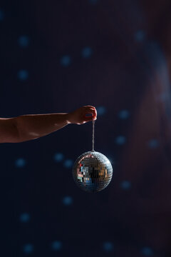 Woman holding disco ball 
