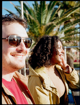 Couple smiling during a warm sunset