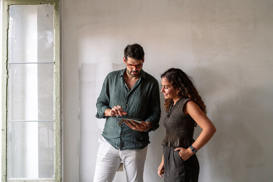 Architect And Client Reviewing Plans