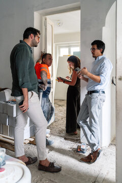 Renovation Team At Doorway