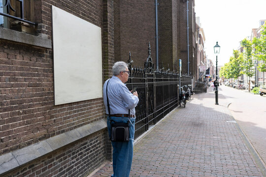 Retired man taking a walk around the city