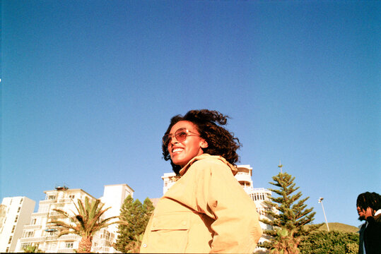 Woman walking with friends along the promenade