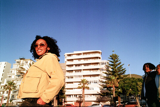 Woman in bright jacket walking in a park