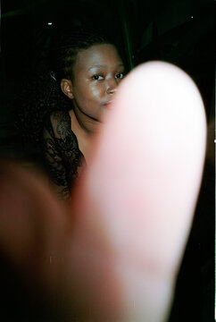 Woman in the dark looking at the camera