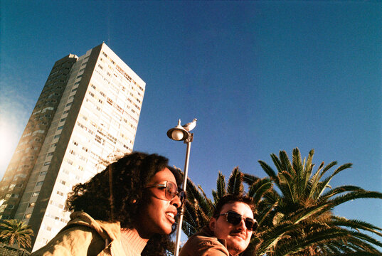 Young couple sitting in a public place
