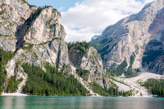 Rocky cliffs and turquoise water at Lake Braies Dolomites