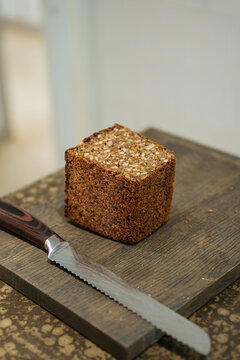 Square multigrain rye bread on wooden board