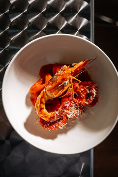 Prawn with pasta in red sauce and cheese