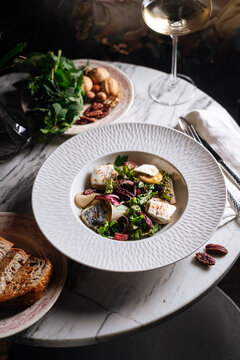 Gourmet salad with cheese, pecans, and greens