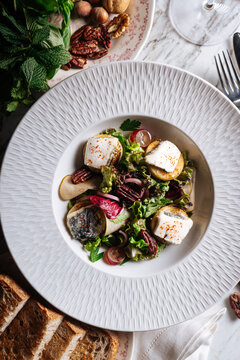Goat cheese salad with nuts and grapes