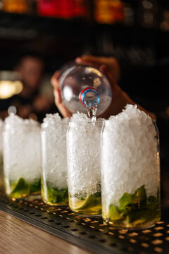 Bartender Preparing Cocktails with Crushed Ice