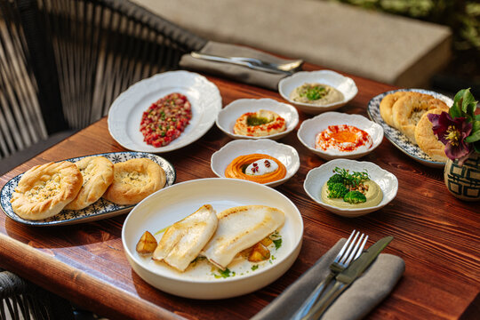 Mediterranean lunch table with cuttlefish and appetizers