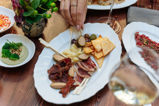Charcuterie plate with cured meats, cheese, and olives